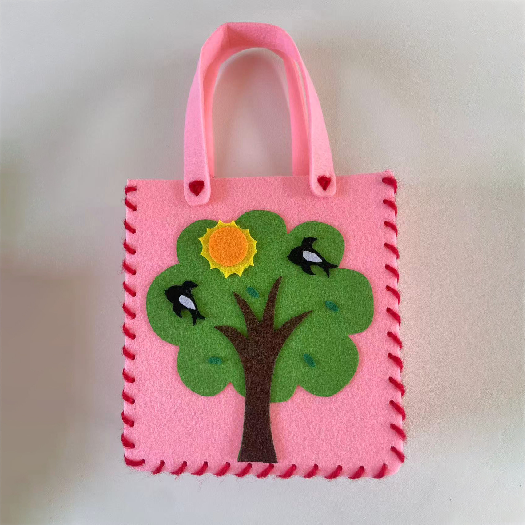 Jardín de infantes bolsas hechas a mano DIY bolsas de tela no tejida material de hacer juguetes creativos para niñas al por mayor