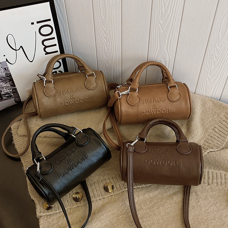 Niche design bag women's new fashion Boston bag portable pillow bag western style cylinder shoulder messenger bag