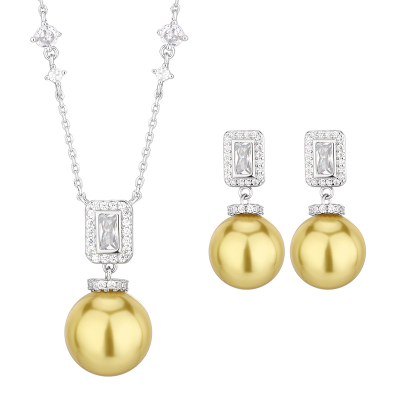 Otoño e invierno nuevo estilo Zhuang Shengsheng joyería fondo de cobre chapado en oro con incrustaciones de perlas de oro profundo borla traje premium femenino 16-14m