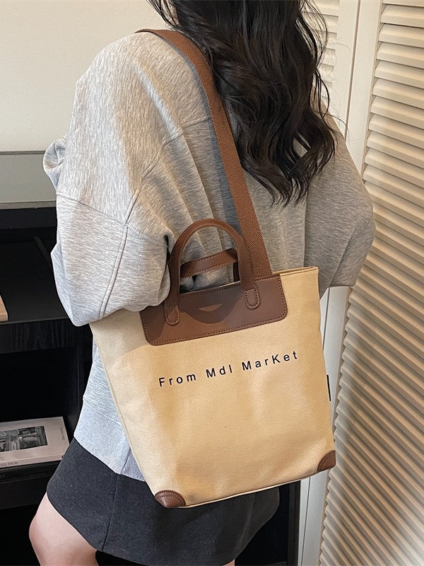 Bolsa de lona coreana hollow-wind casual bolso de mano para mujeres 2026 nueva bolsa de hombro casual simple y lujosa