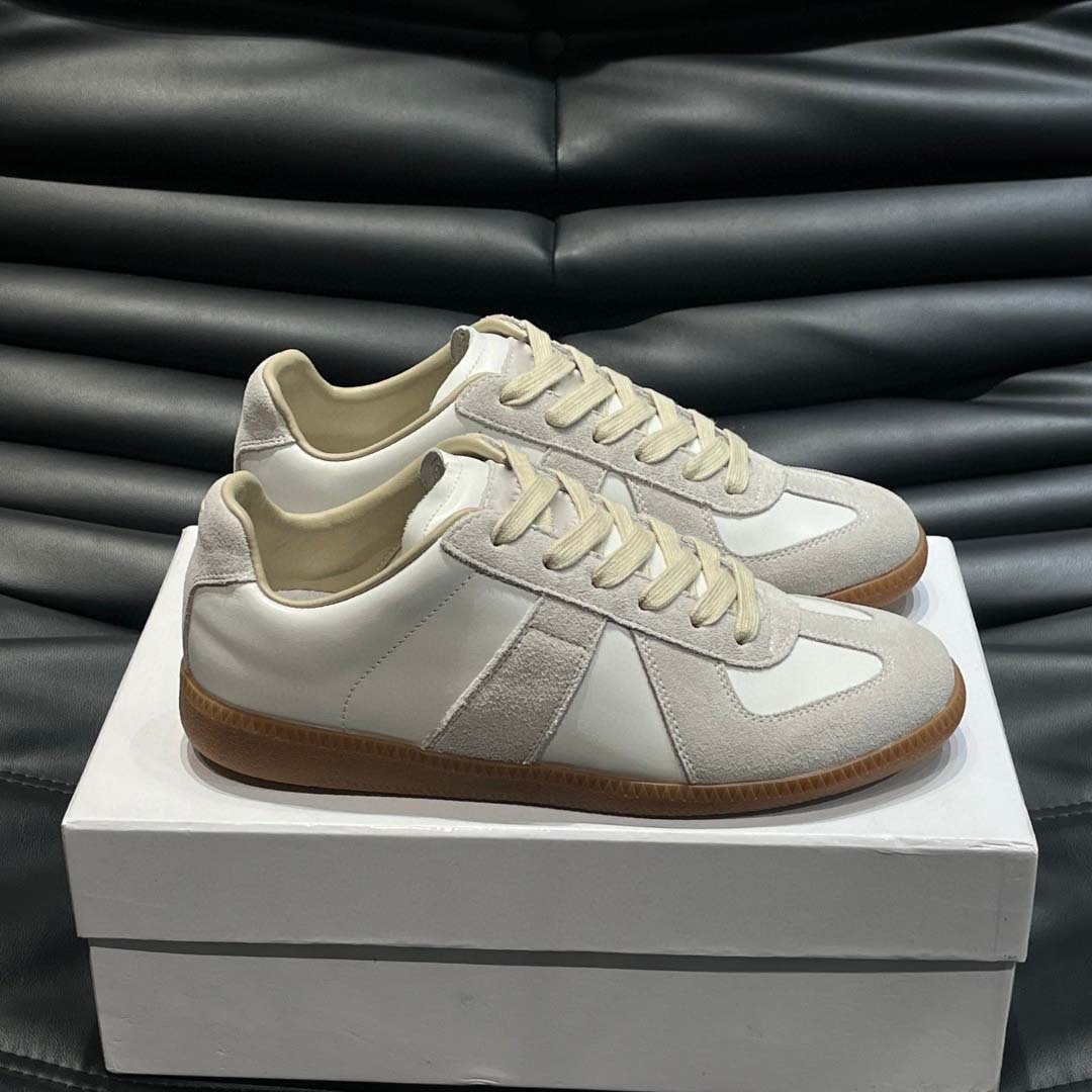 Estación europea 2025 nuevos zapatos de entrenamiento alemanes para hombres y mujeres zapatos planos casuales de todo fósforo zapatos de pareja con cordones de cuero zapatillas de deporte