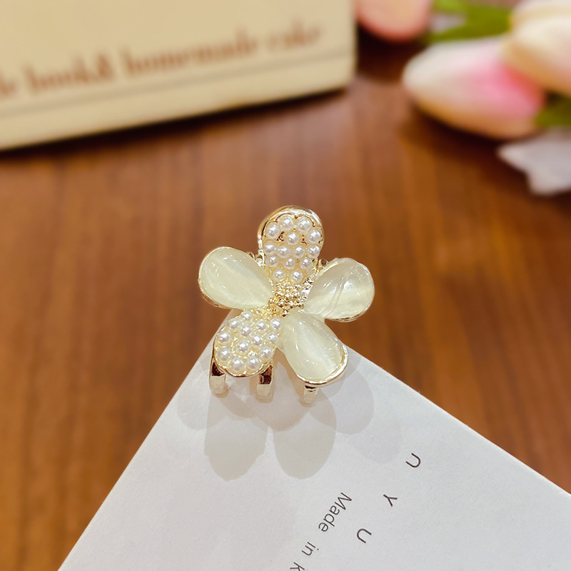 Ojo de gato perla flor-oro