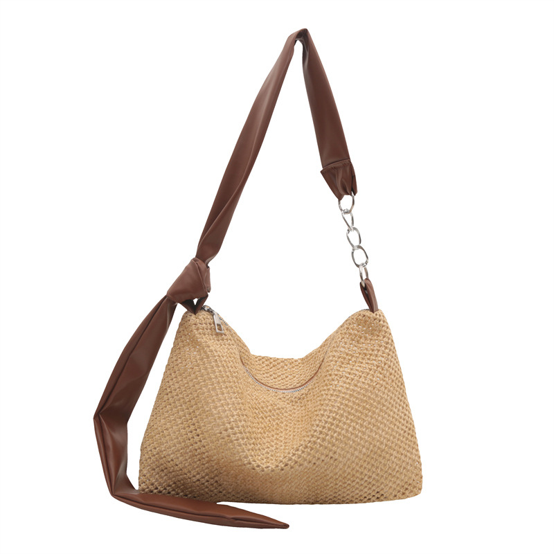 Bolsa de paja de moda coreana de gran capacidad para mujeres este año popular nicho diseño de banda ancha tejida de hombro bolsa de hombro