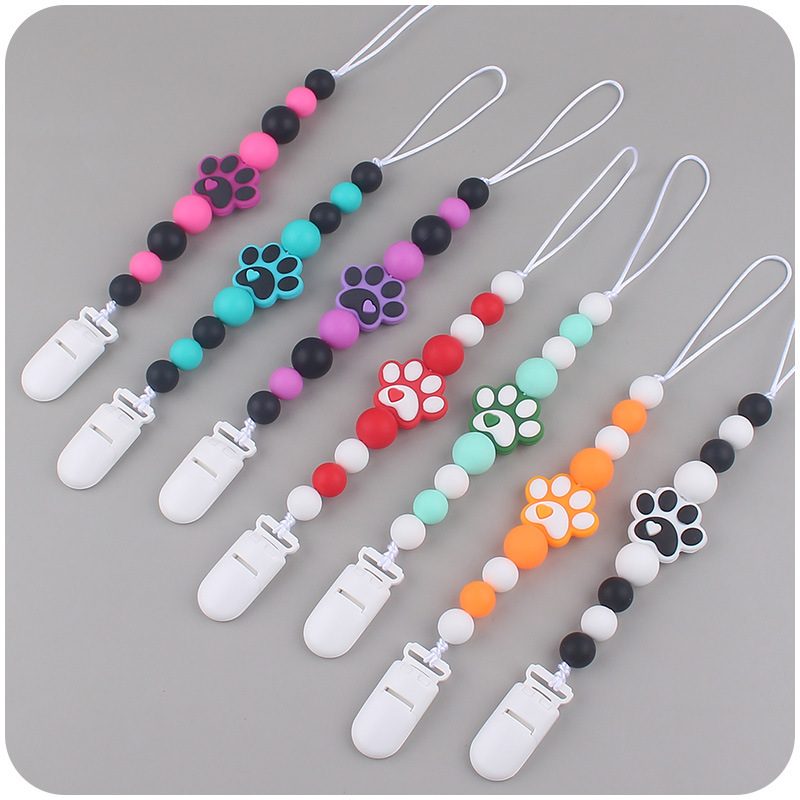 Nuevo bebé suministros dibujos animados perro garra goma creativo bebé lindo silicona mordedura pezón cadena anti-gota cadena