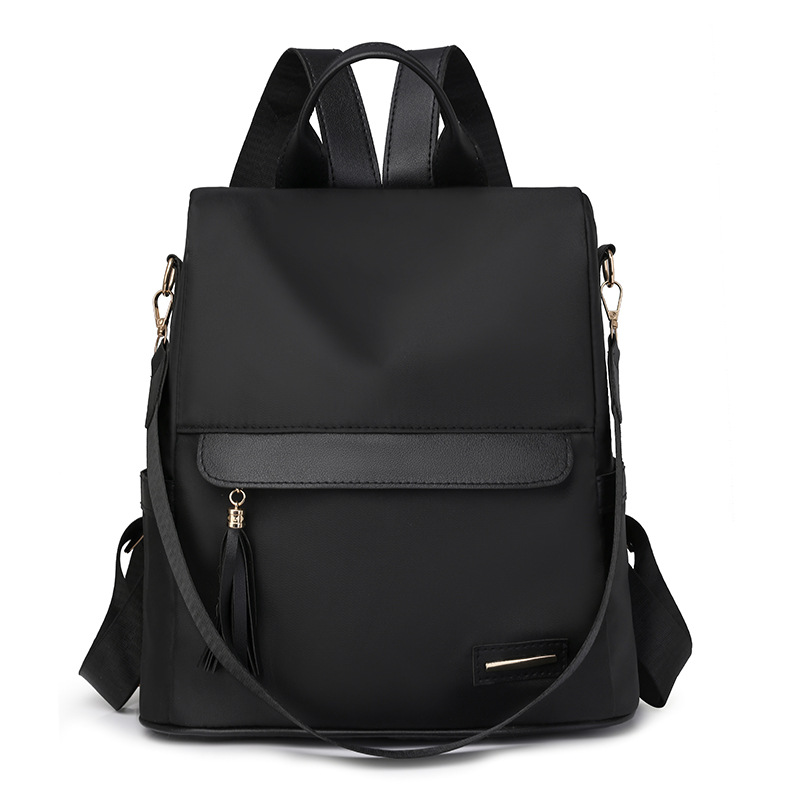 Comercio exterior nueva dama casual nailon mochila antirrobo moda borla color de contraste mochila de viaje de gran capacidad al por mayor