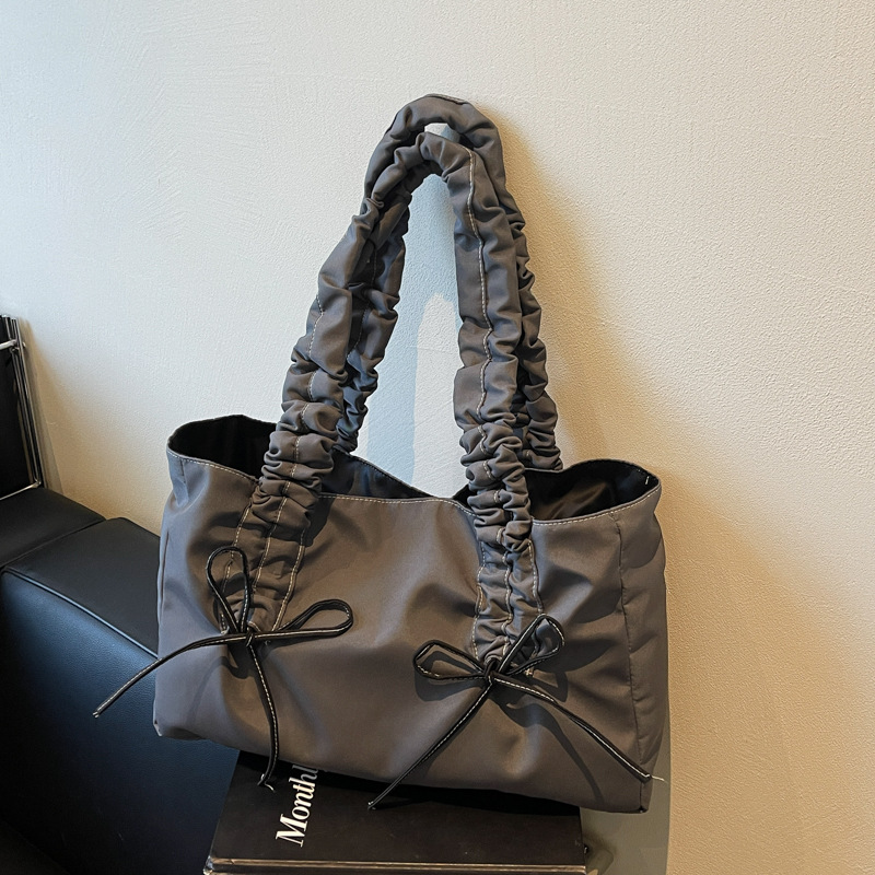 Bolso de arco de la mujer 2025 nueva moda coreana bolso de tela de gran capacidad bolso de mujer de alto valor facial
