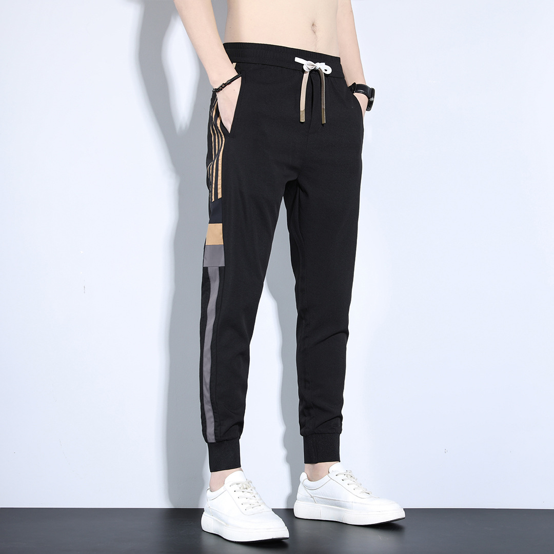 Pantalones deportivos de primavera y otoño sueltos para hombres 2023 nuevos pantalones largos casuales versátiles marca de moda de primavera pantalones harén atados al tobillo