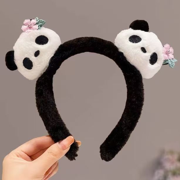 男女通用の大きいパンダのカチューシャは卸売りします。