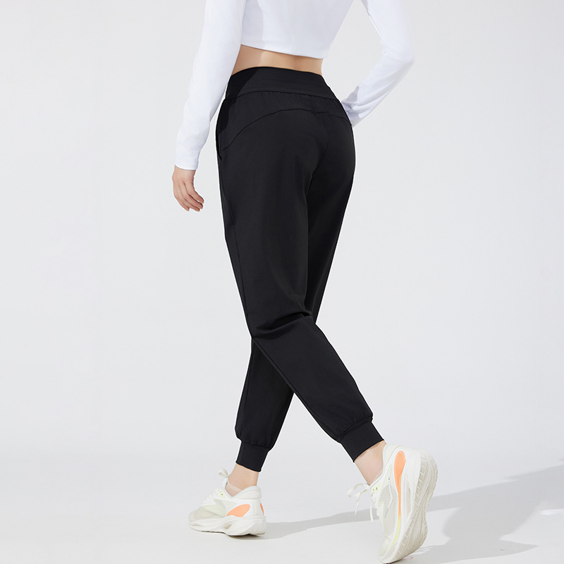 Pantalones deportivos casuales elásticos y transpirables estilo otoño 2026 para mujer, ideales para yoga, correr y fitness al aire libre.