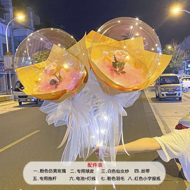 光る夜市の円形の赤い屋台のネットを並べてボールを押して会の風船のイルミネーションの明かりの告白のロマンチックな波の地帯のスーツを押します。|undefined