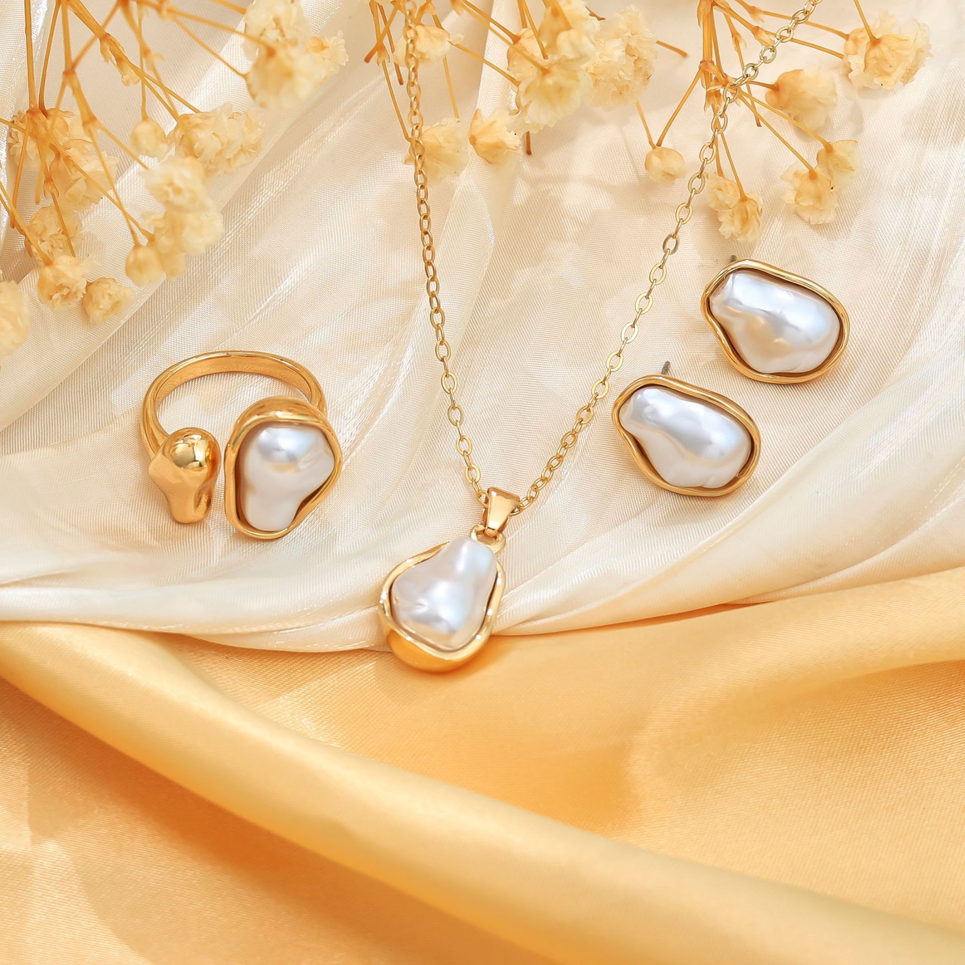 Venta caliente transfronteriza europea y americana, conjunto de anillos de collar, pendientes de moda de perlas del sexo opuesto, pendientes de mujer de alta calidad