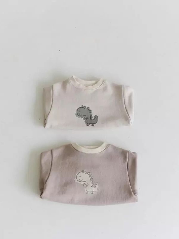 26 nuevos modelos de primavera de peleles para bebé estilo japonés y coreano, monos con estampado de dinosaurios estilo INS, peleles de manga larga para bebé.
