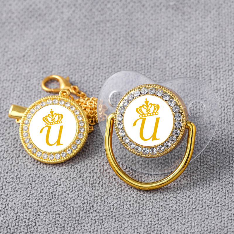 AliExpress Venta caliente oro transparente 26 corona carta bebé punto taladro jugando boca con diamante bebé chupete de oro