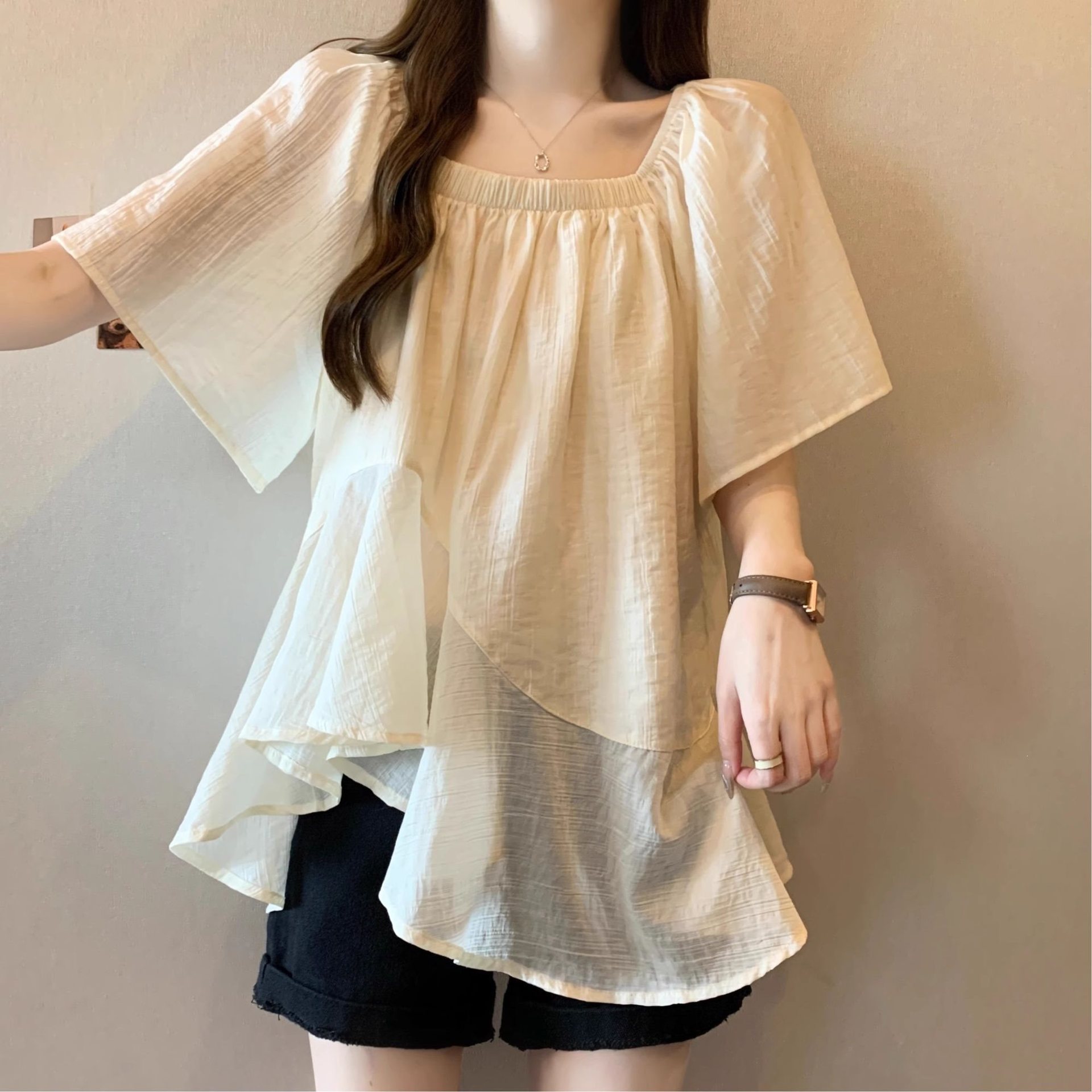 Plus-size solid color irregular short-sleeved T-shirt for men and women, new summer style, fashionable design, tummy-covering top/t-shirt.