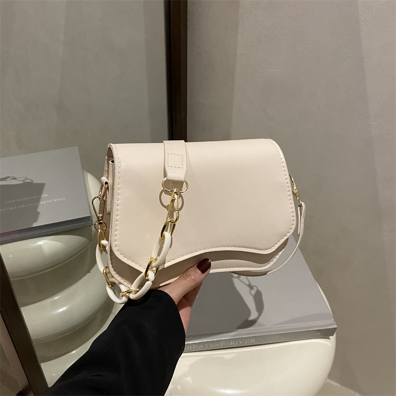 Bolsos axilales de textura simple para mujeres 2025 primavera y verano nueva moda edición limpia de moda extranjera bolso de hombro simple