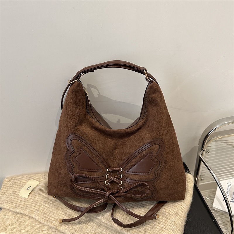 Mochila de arco de gran capacidad para mujeres otoño y invierno 2024 nueva mochila retro texturizada bolsa de viaje