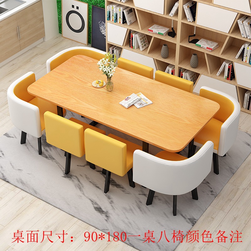 180*90 color madera, cuero amarillo, amarillo y blanco, una mesa y ocho sillas