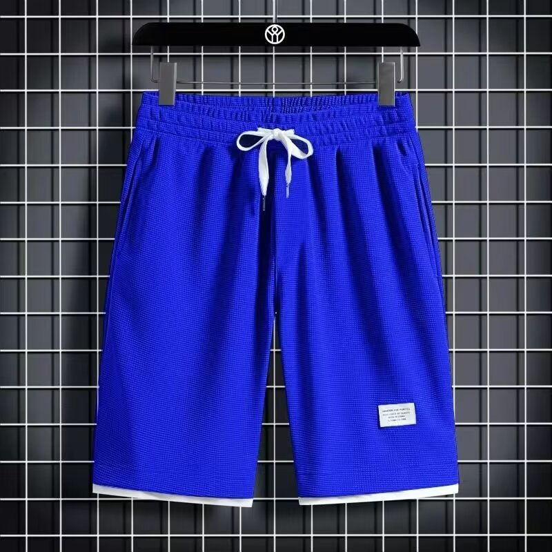 Camisa menos ropa Waffle pantalones de cinco puntos para hombres verano nuevo estilo estilo Hong Kong pantalones cortos de dos piezas falsos de color recto suelto