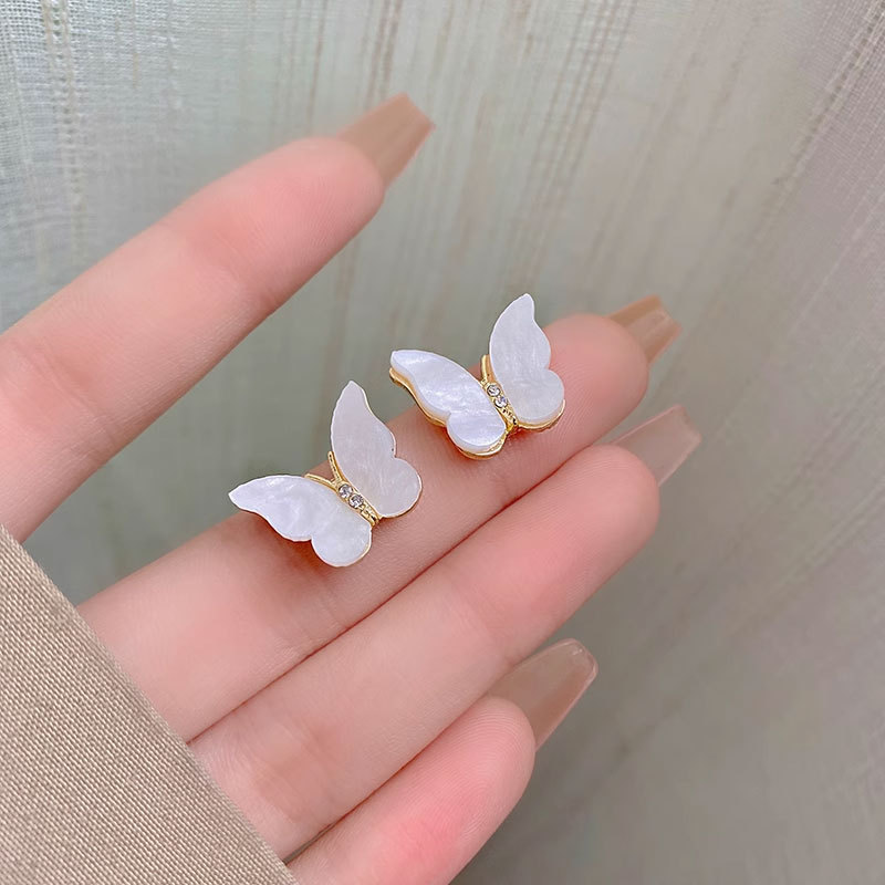 Aguja de plata de moda alta sensación de diamante de goteo de aceite pendientes nicho universal elegante pernos de orejas ligero lujoso temperamento simple orejas para mujeres