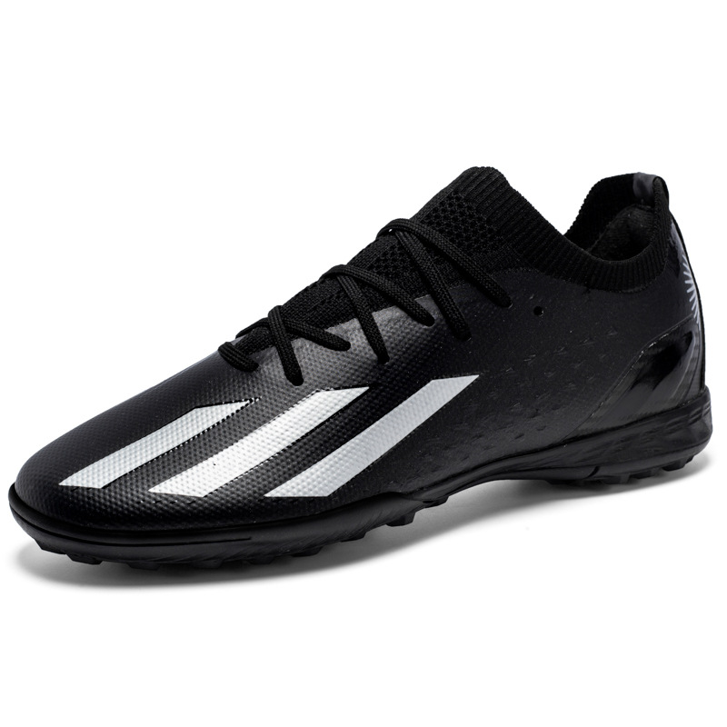 Nuevos juveniles transfronterizos de clavos largos de clavos deportivos de baja altura de la Copa del Mundo TF zapatos de fútbol entrenamiento al por mayor