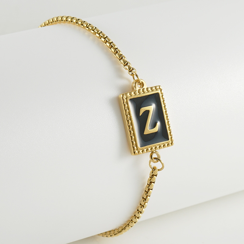 La moda europea y americana transfronteriza del acero inoxidable 26 pulsera inglesa de la letra en relieve pulsera Titanium de la cremallera del acero 18K de la frontera para las mujeres