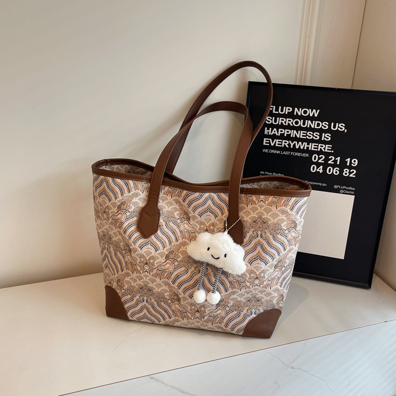 Nueva bolsa de hombro de gran capacidad de estilo chino para mujeres 2024 otoño nuevo estilo de alta calidad de impresión de patrón de montaña y mar bolsa especial