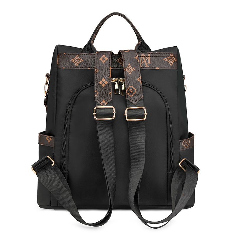 Comercio exterior al por mayor 2024 nueva mochila antirrobo de nailon para mujer retro, mochila multifuncional de doble uso de color de contraste de moda