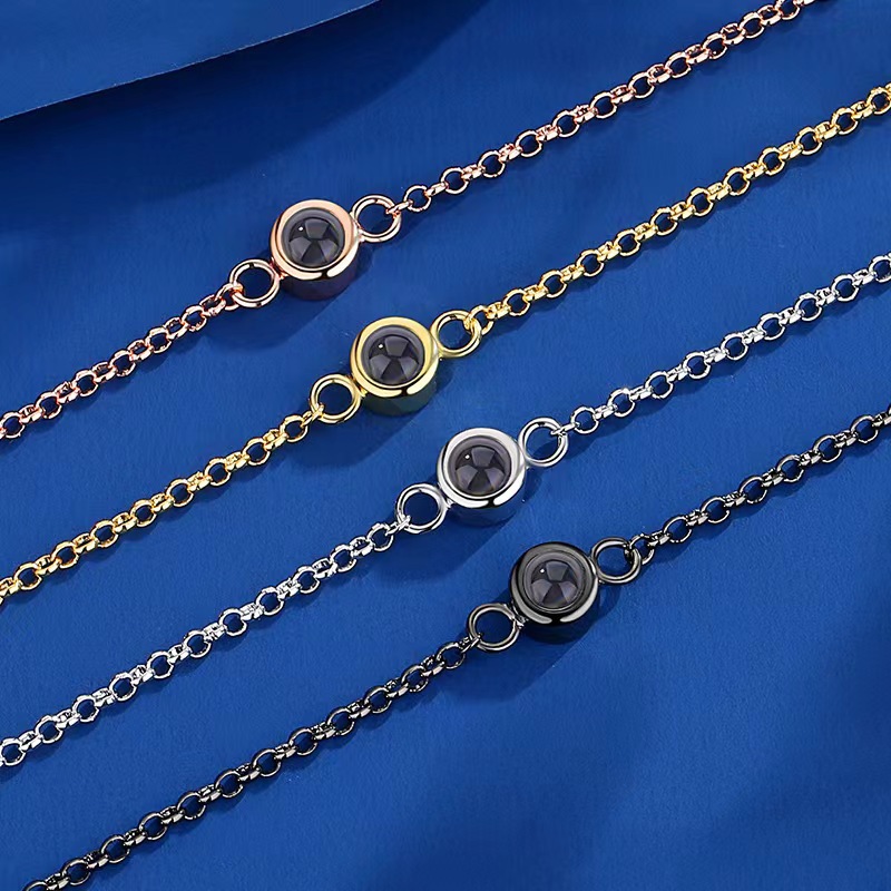 Estilo europeo y americano Comercio exterior transfronterizo nuevo retráctil micro-tallado nano proyección pulsera 100 idiomas te amo simple