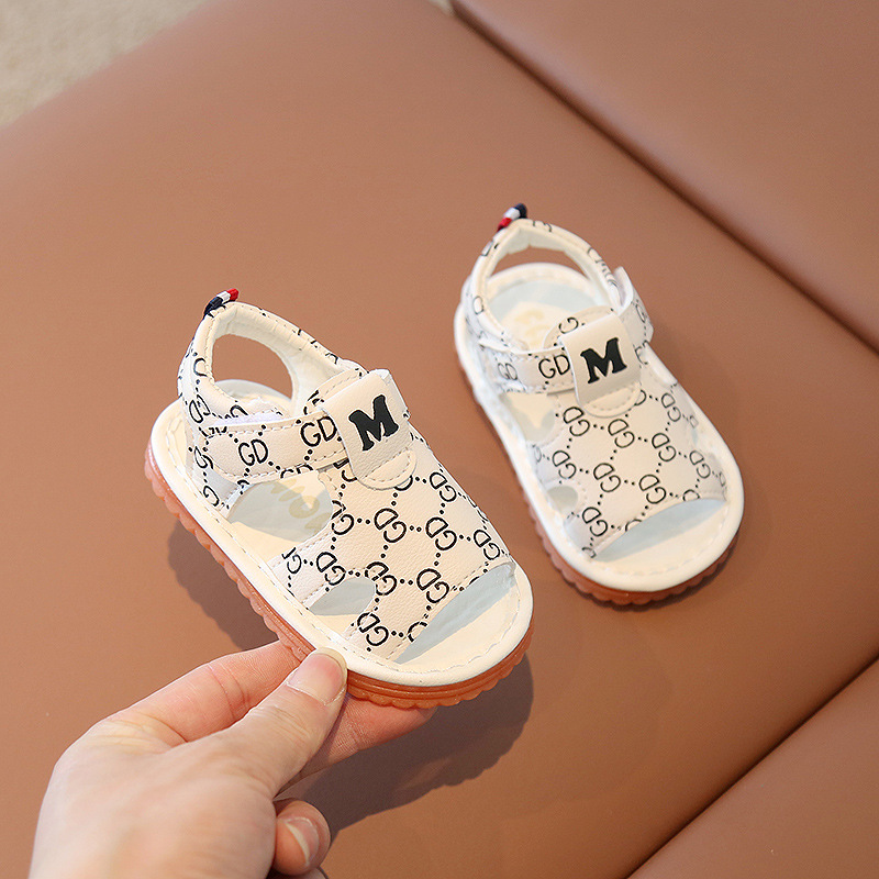 A new soft sole children's sandal for summer 2022 Baotou baby sandal for boys and girls is called baby shoes