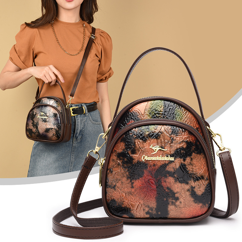 Bolsa de moda transfronteriza de madres de mediana edad, bolso de hombro de impresión de cuero blando, 2024 nuevo estilo chino de damas, bolso de mochila