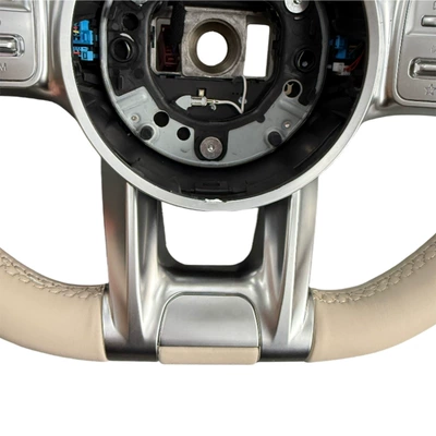 with buttons, silver paddle shifters, and – Steering wheel