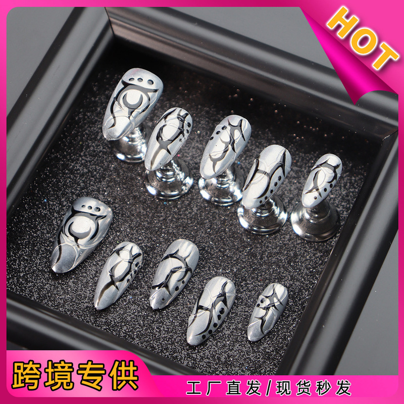 Real Shot of Silver Almond-Shaped Nail Tips in European and American Gothic Style with Black Totem and Futuristic Mechanical Design for Cross-Border Nail Art