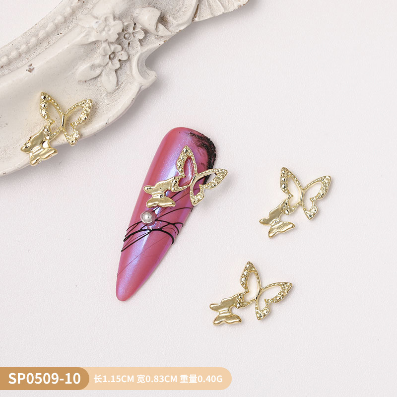 Venta caliente transfronteriza mariposa joyería de uñas aleación hueca alas de diamantes estrella de cinco puntas accesorios de decoración de uñas al por mayor