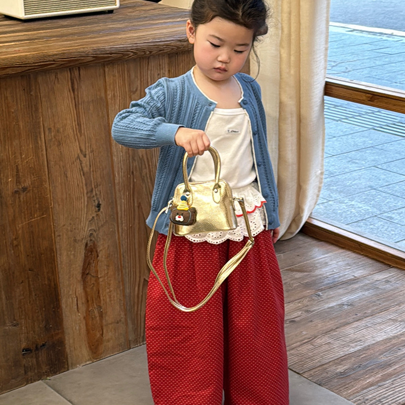 Versión coreana del bolso de hombro para niña de color sólido de dibujos animados lindo cachorro colgante bolso de bebé nuevo mini bolso para niños