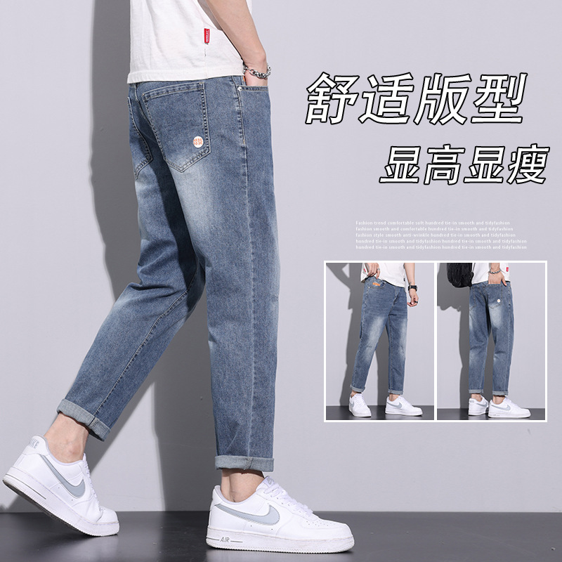 Pantalones vaqueros blancos lavados vintage de la estación europea de los hombres nuevos pantalones largos de los hombres elásticos flojos de moda del todo-fósforo