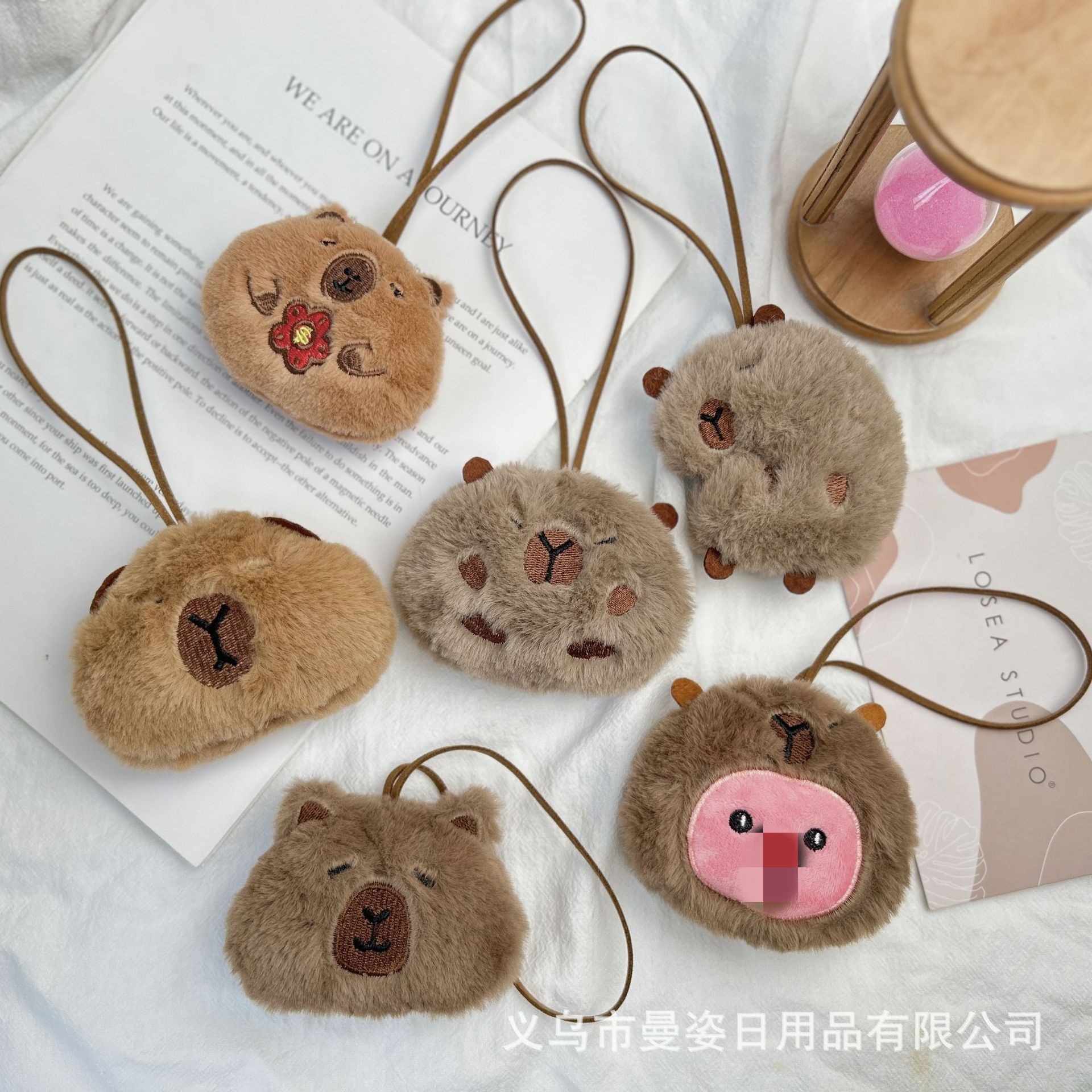 Cartoon plush capybara pendant with name tag, suitable for kindergarten children, and bag charm.