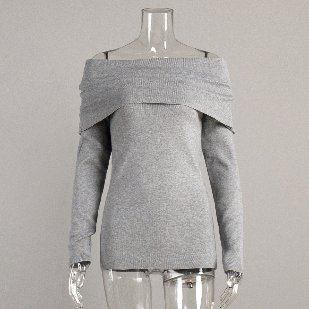 Cross-border 2026 nuevo estilo europeo y americano un hombro temperamento de diseño de hombro abierto sensación delgada envuelta en un suéter de punto de punto para mujeres