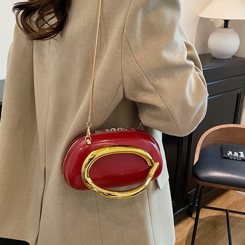 Bolsa de alta sensación para mujeres 2026 primavera nueva bolsa de brazo de viaje de moda simple nicho de diseño de hombro mochila