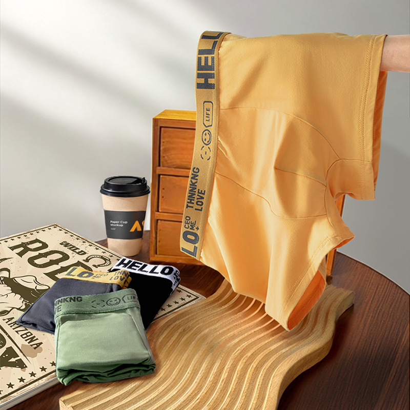 Ropa interior masculina, letras juveniles, cintura media suelta y cómoda, transpirable y sin costuras, pantalones cortos de cuatro esquinas para estudiantes al por mayor