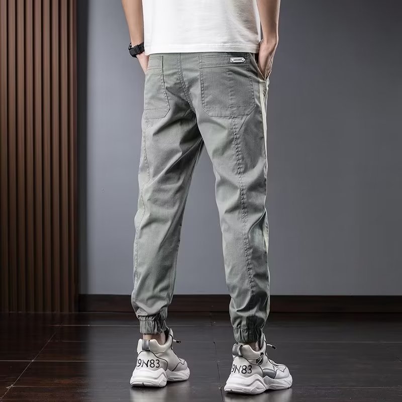 Pantalones de herramientas para hombres, modelos de primavera y otoño, moda de marca de moda, otoño delgado, pies sueltos, pantalones vaqueros de talla grande en forma de cono Harlan para hombres