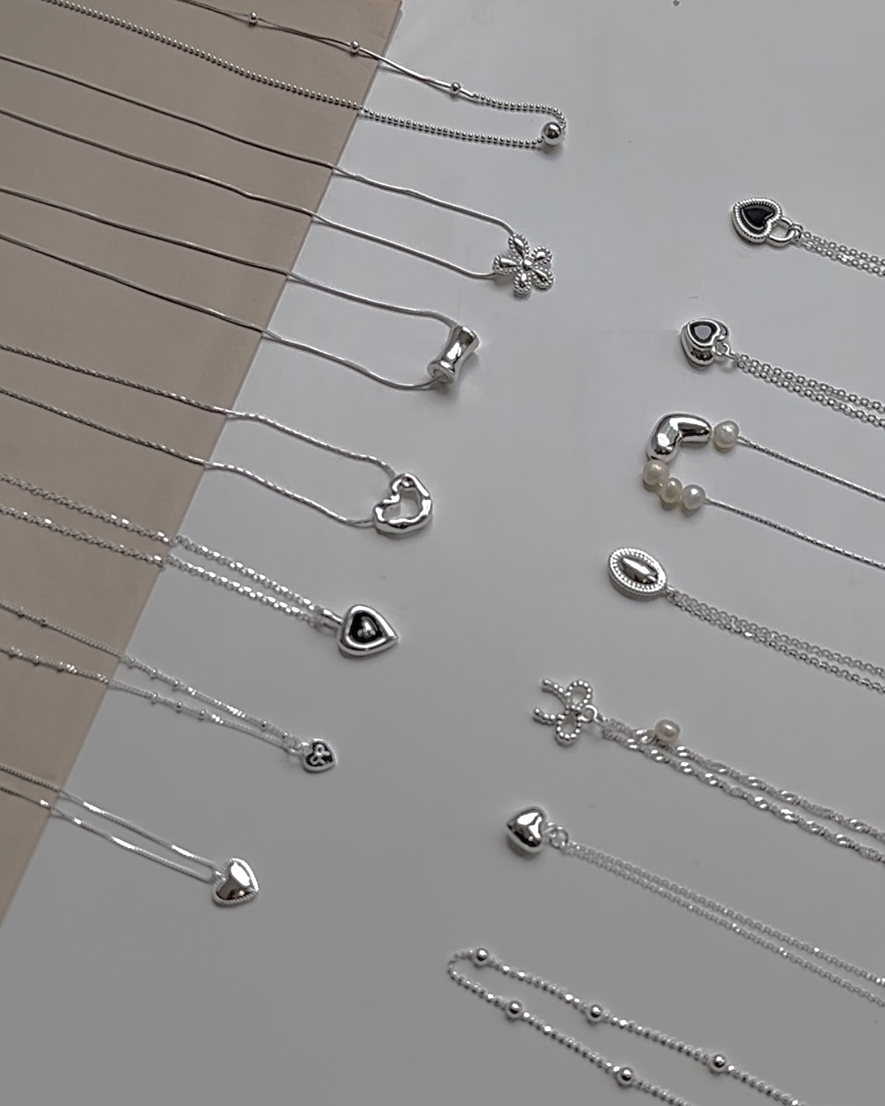 Collana con ciondolo a cuore e fiocco in argento, catena a strati_voghion.com