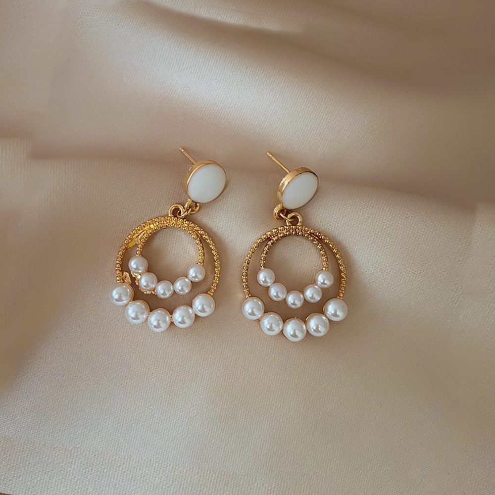 Aguja de plata de moda alta sensación de diamante de goteo de aceite pendientes nicho universal elegante pernos de orejas ligero lujoso temperamento simple orejas para mujeres