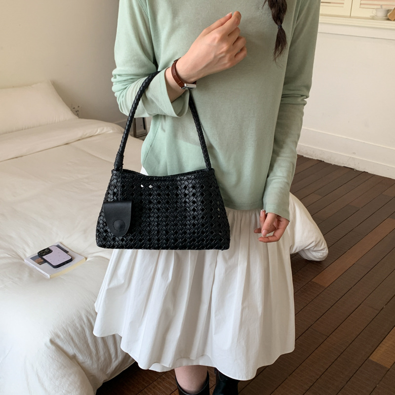 Bolsa de brazo hueco para mujeres 2026 verano nuevo estilo francés lujoso viaje de hombro portátil bolso de palo