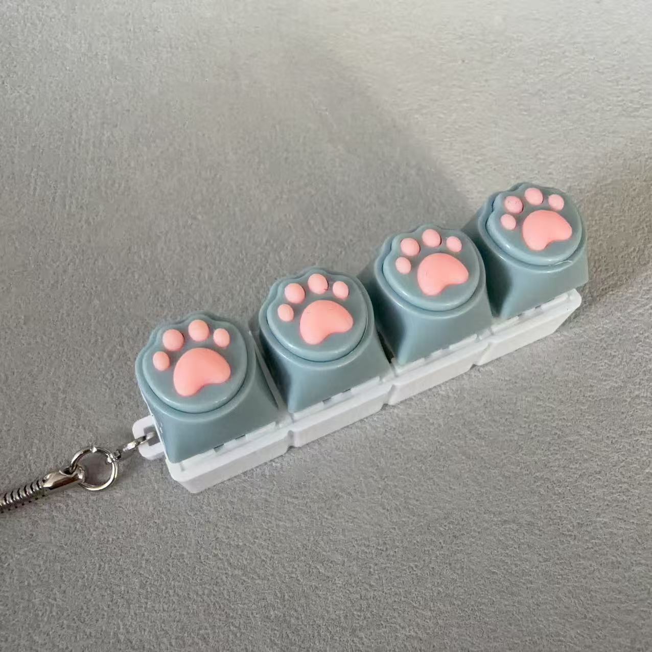 Four-button white shell - silicone grey cat paw