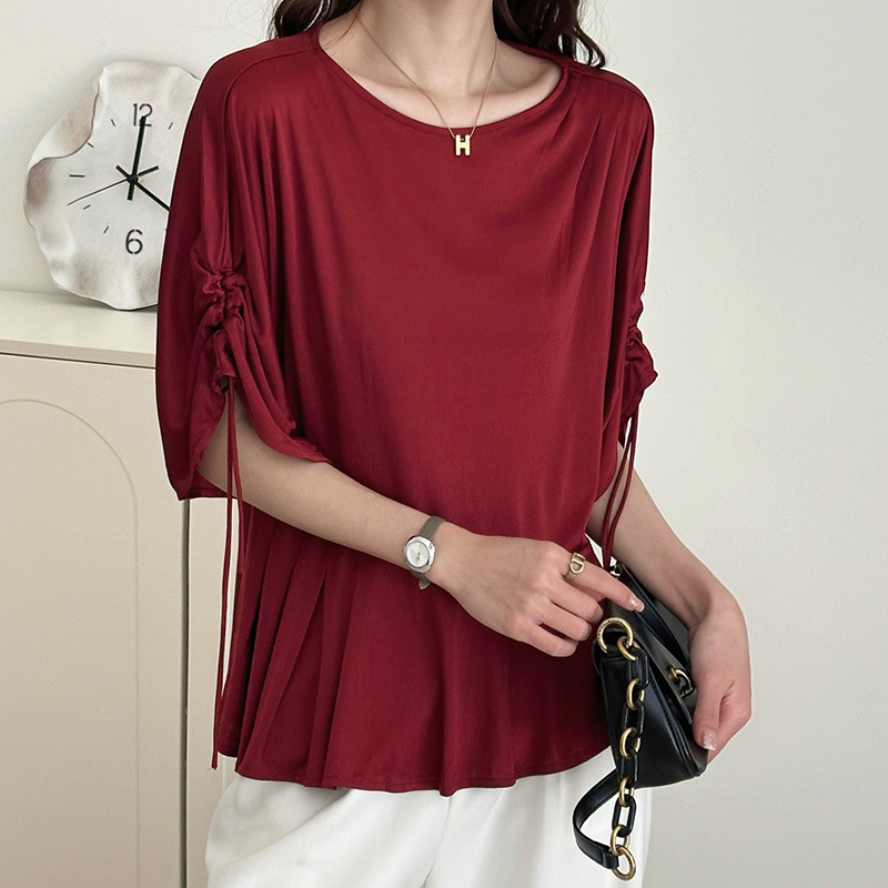 French-style round-neck knit top with bat sleeves, drawstring tie, ruffled hem, waist-cinching, mid-sleeve base shirt