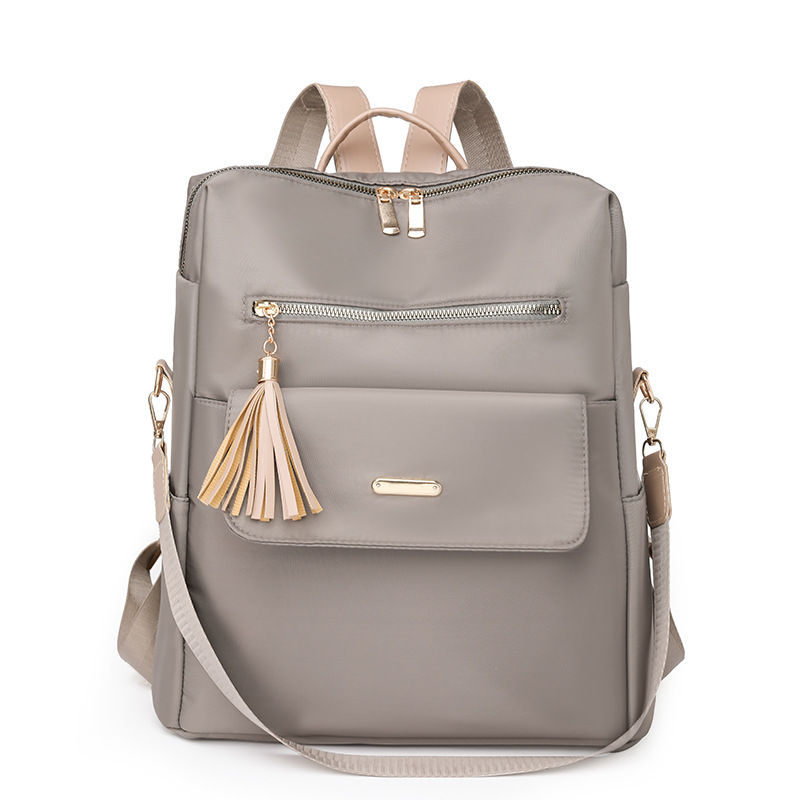 Fábrica al por mayor 2023 nueva versión coreana de la mochila de nailon para mujer moda literaria color de contraste viaje mochila de doble uso marea