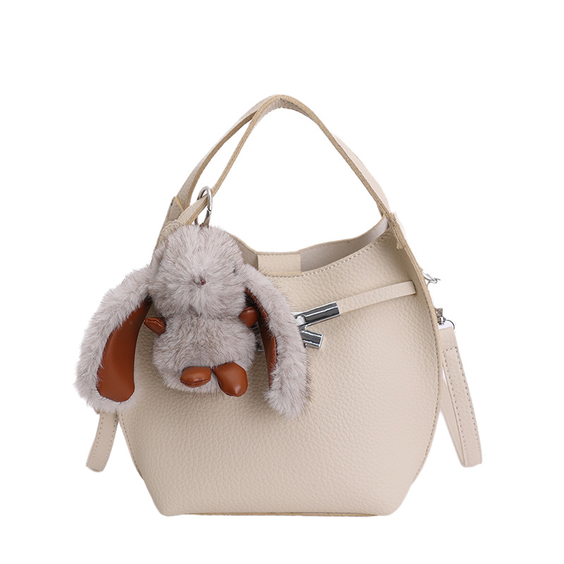 Bolso de mujer nuevo estilo coreano nicho de moda lichi bolso de cubo portátil de alta sensación de ocio mochila de viaje