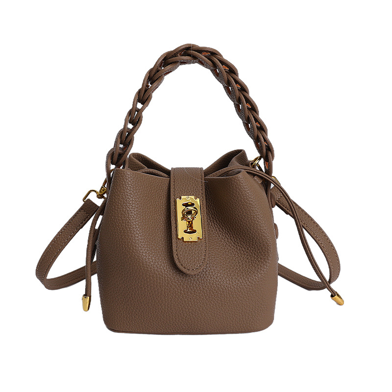 Bolsos de balde portátiles de alta calidad para mujeres 2026 verano nuevo lichi estampado viaje diario ocio versátil mochila