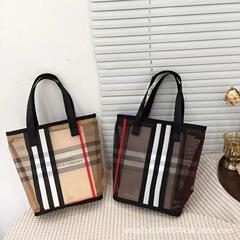 網糸化粧バッグの丸いバケツのハンドバッグは大容量で旅行に出かけます。