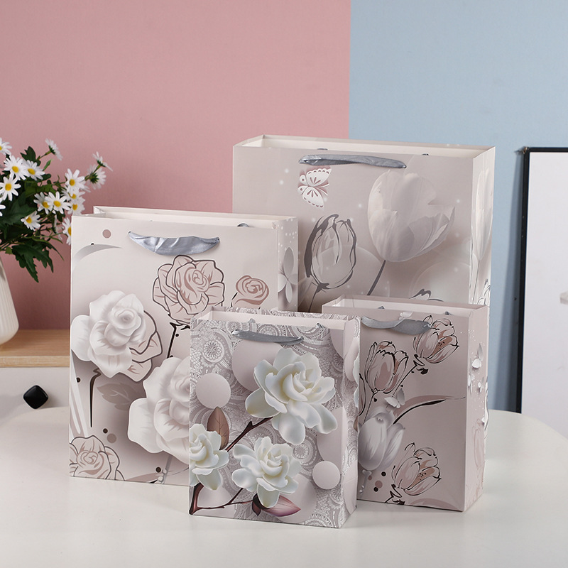 厂家直供多款印花礼品袋创意时尚商场服装购物袋生日礼物手提纸袋